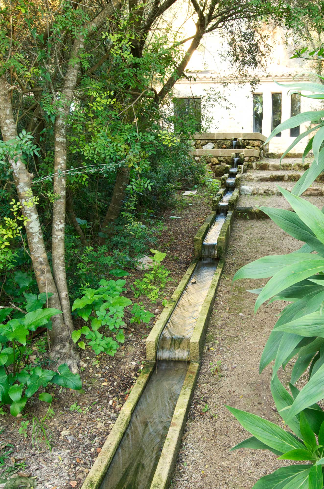 Dramatic 100meter long limestone rill in a Mallorca garden - James Aldridge Landscape and Garden Design